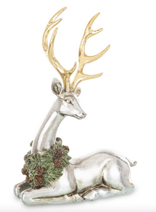 Christmas ornament/figure lying reindeer with wreath