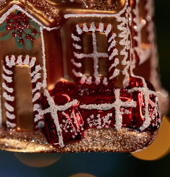 Christmas ornament – a golden house filled with gifts