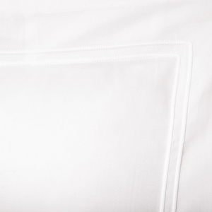 Decorative pillow by Yves Delorme, from the Triomphe (Blanc) collection