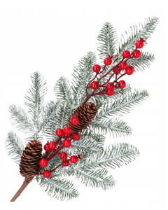 Christmas decoration - a snow-covered spruce branch with rowan berries and cones
