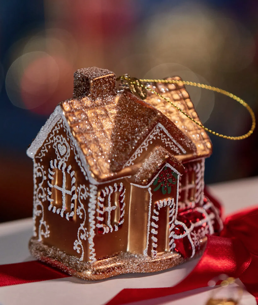 Christmas ornament – a golden house filled with gifts