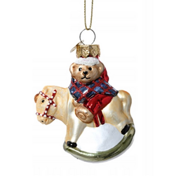 Christmas decoration - multi-colored teddy bear on a rocking horse