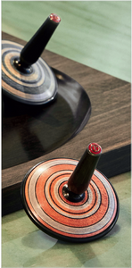 Monn spinning tops with ebony bases by Armani Casa