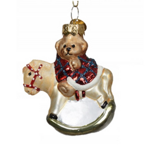 Christmas decoration - Teddy bear with a white hat on a rocking horse