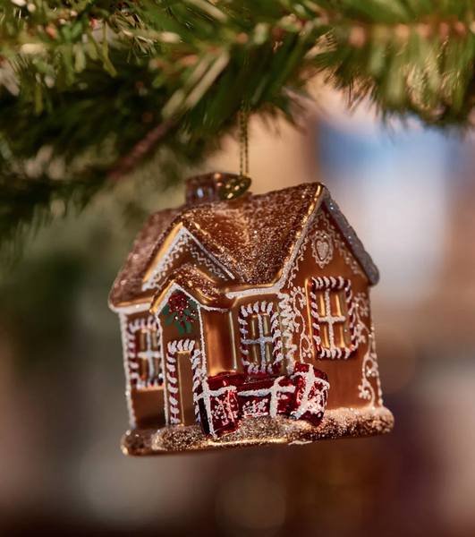 Christmas ornament – a golden house filled with gifts