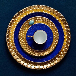 Set of four L'Objet canapé plates, from the Lapis collection