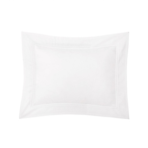 Decorative pillow by Yves Delorme, from the Triomphe (Blanc) collection