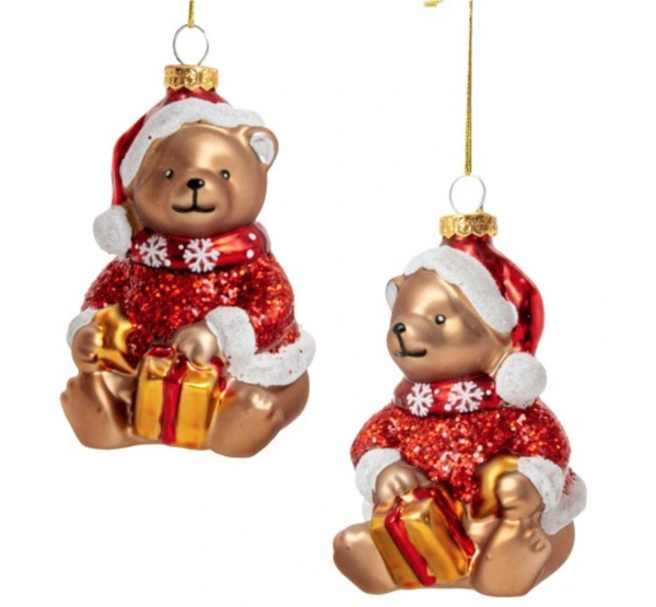 Christmas ornament - a teddy bear in a Santa Claus costume with a gift